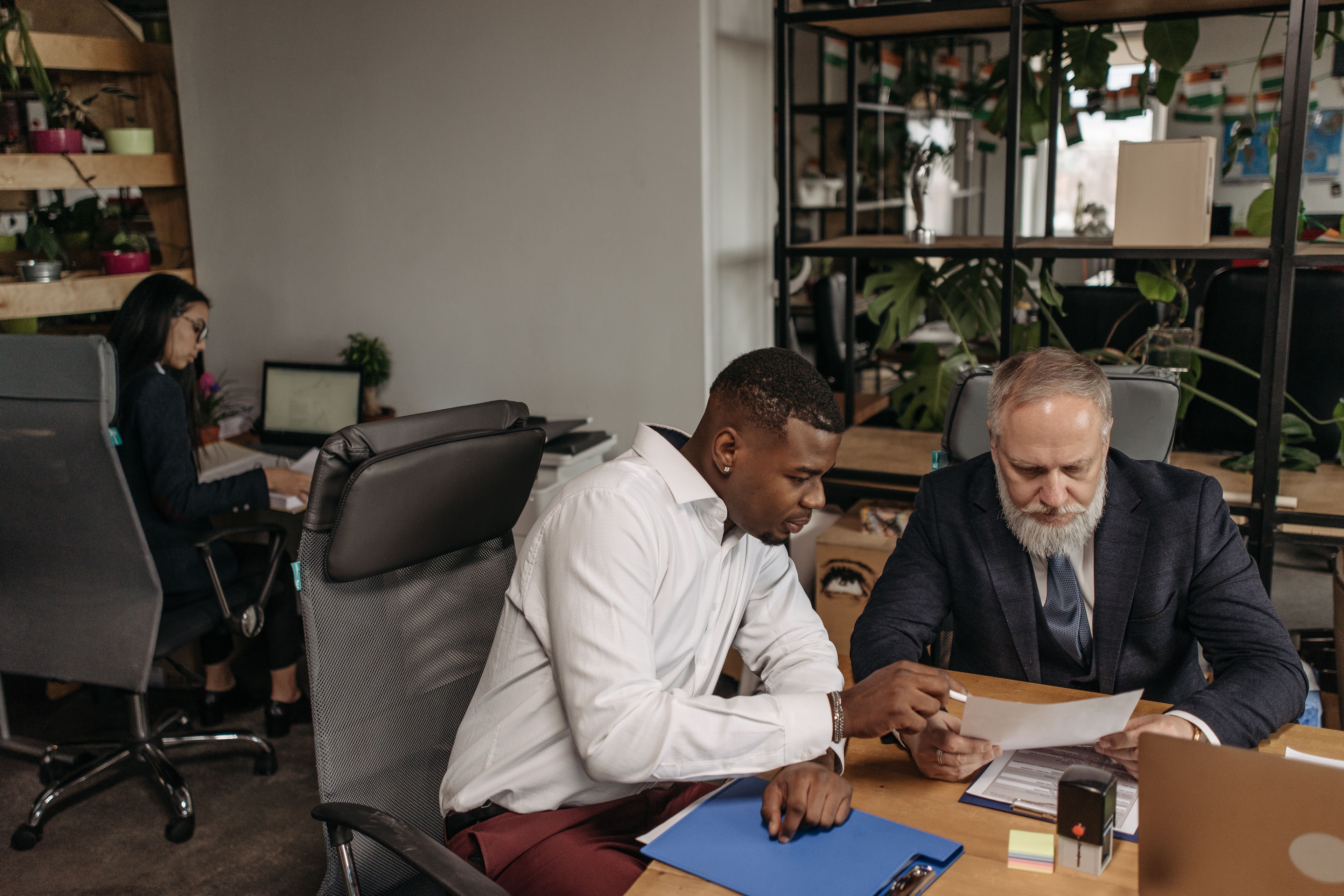 Professionals reviewing a document in an office